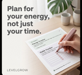 A hand uses a pink pen to fill out an Energy Tracker and Habit Tracker sheet on a wooden desk. Large text on the left reads, 'Plan for your energy, not just your time.